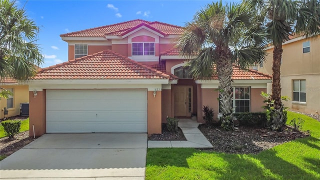 132 Cordova Ave, Davenport, FL 33897 - mediterranean / spanish-style home with stucco siding, a tiled roof, concrete driveway, and an attached garage
