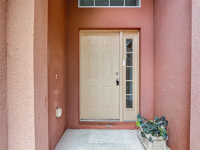 132 Cordova Ave, Davenport, FL 33897 - property entrance with stucco siding