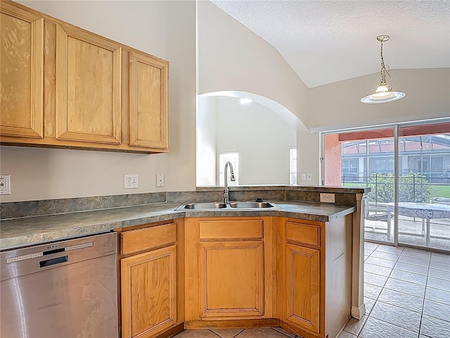 132 Cordova Ave, Davenport, FL 33897 - kitchen featuring stainless steel dishwasher, lofted ceiling, a peninsula, dark countertops, and light tile patterned floors