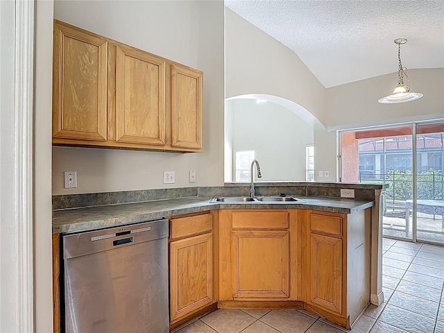132 Cordova Ave, Davenport, FL 33897 - kitchen featuring dishwasher, vaulted ceiling, dark countertops, light tile patterned flooring, and a peninsula