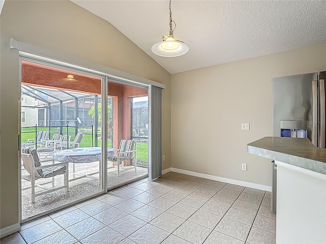 132 Cordova Ave, Davenport, FL 33897 - unfurnished dining area with light tile patterned flooring, a sunroom, lofted ceiling, and a textured ceiling