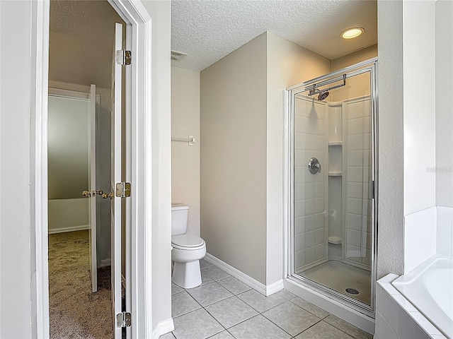 132 Cordova Ave, Davenport, FL 33897 - bathroom with a stall shower, tile patterned flooring, a bath, and a textured ceiling