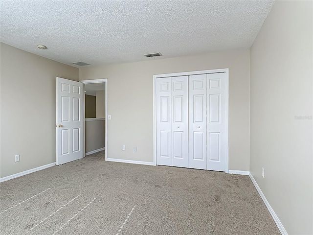 132 Cordova Ave, Davenport, FL 33897 - unfurnished bedroom with carpet, a textured ceiling, and a closet