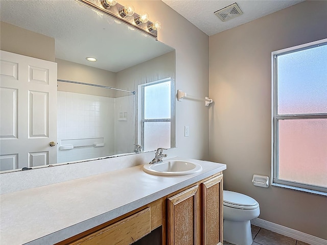 132 Cordova Ave, Davenport, FL 33897 - full bath featuring vanity, tile patterned floors, a shower, and a textured ceiling
