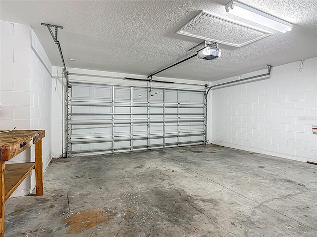 132 Cordova Ave, Davenport, FL 33897 - garage featuring a garage door opener and concrete block wall