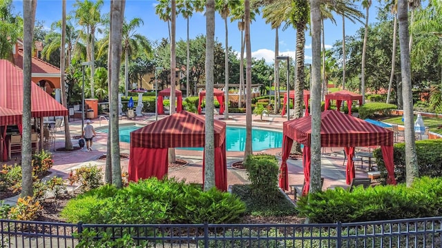 132 Cordova Ave, Davenport, FL 33897 - view of playground with a community pool, a patio, and view of scattered trees