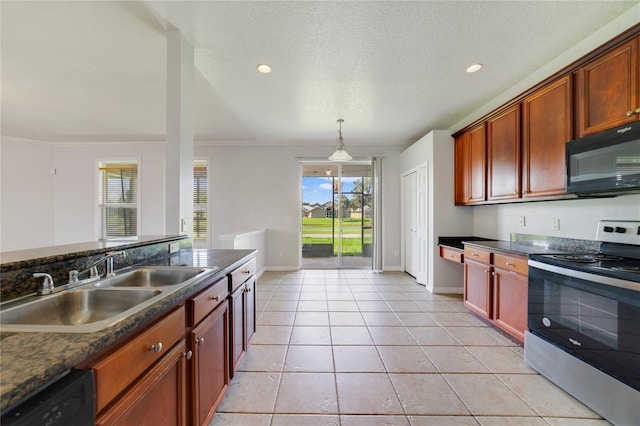 2298 The Oaks Blvd, Kissimmee, FL 34746 - kitchen featuring black appliances, dark countertops, plenty of natural light, recessed lighting, and ornamental molding