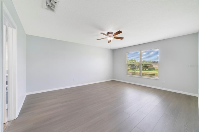 2298 The Oaks Blvd, Kissimmee, FL 34746 - spare room with ceiling fan and wood finished floors