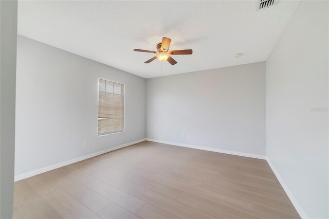 2298 The Oaks Blvd, Kissimmee, FL 34746 - unfurnished room featuring a ceiling fan and light wood finished floors