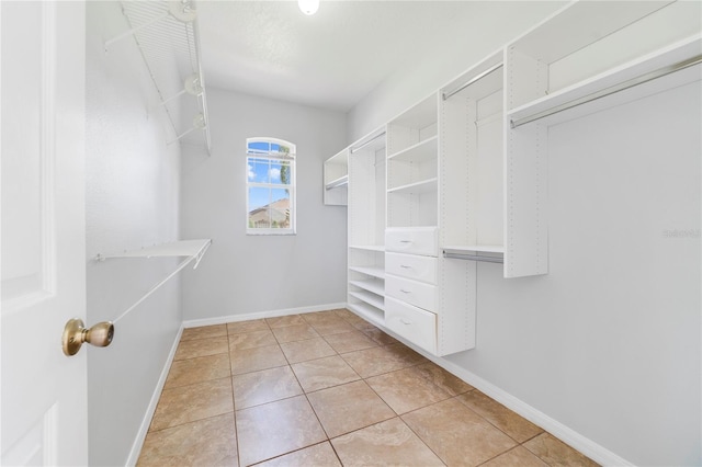 2298 The Oaks Blvd, Kissimmee, FL 34746 - walk in closet featuring light tile patterned floors