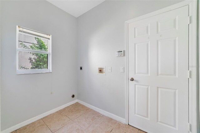 2298 The Oaks Blvd, Kissimmee, FL 34746 - washroom featuring hookup for an electric dryer, hookup for a washing machine, and light tile patterned floors