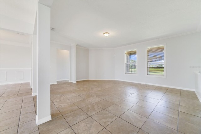 2298 The Oaks Blvd, Kissimmee, FL 34746 - empty room with light tile patterned flooring and crown molding