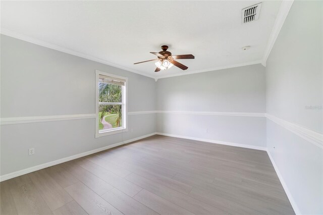2298 The Oaks Blvd, Kissimmee, FL 34746 - unfurnished room with a ceiling fan, ornamental molding, and wood finished floors
