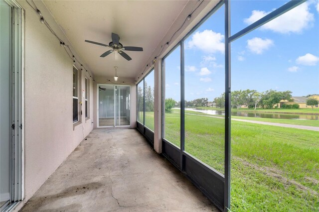 2298 The Oaks Blvd, Kissimmee, FL 34746 - unfurnished sunroom with a water view and a ceiling fan