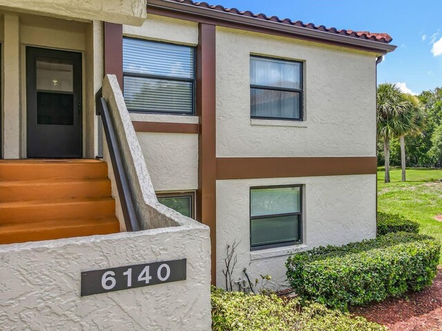6140 Burnside Cir Unit 204, Orlando, FL 32822 - view of home's exterior featuring stucco siding