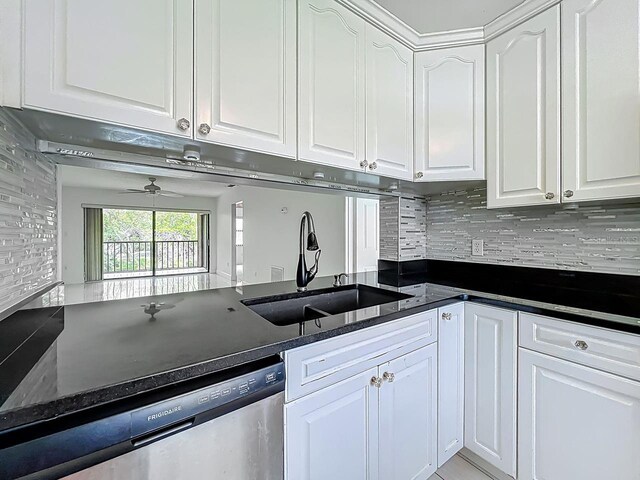 6140 Burnside Cir Unit 204, Orlando, FL 32822 - kitchen featuring dishwasher, white cabinets, backsplash, ceiling fan, and dark stone countertops
