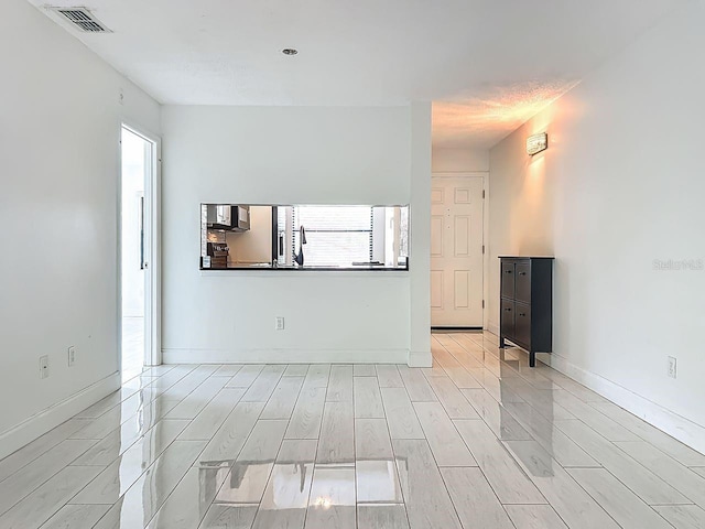 6140 Burnside Cir Unit 204, Orlando, FL 32822 - unfurnished room with plenty of natural light and light wood-type flooring