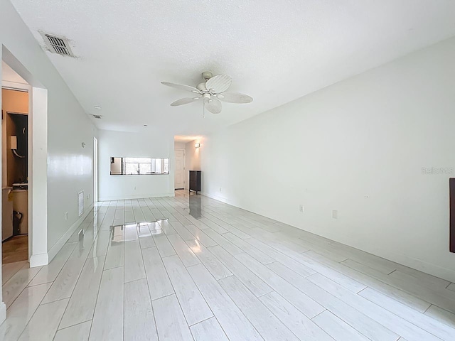 6140 Burnside Cir Unit 204, Orlando, FL 32822 - unfurnished room featuring a ceiling fan and light wood-style floors