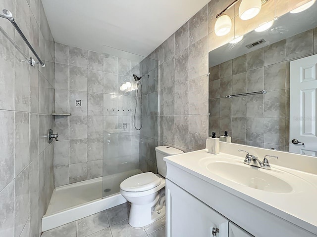 6140 Burnside Cir Unit 204, Orlando, FL 32822 - full bathroom featuring tile walls, tile patterned floors, a tile shower, and vanity