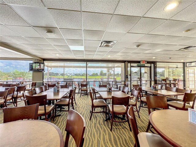 6140 Burnside Cir Unit 204, Orlando, FL 32822 - dining room featuring a paneled ceiling