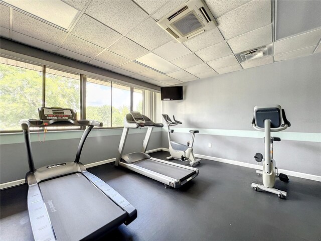 6140 Burnside Cir Unit 204, Orlando, FL 32822 - exercise room with baseboards and a paneled ceiling