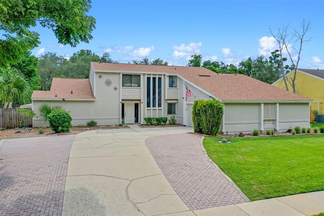 5630 Spring Run Ave, Orlando, FL 32819 - view of front of home featuring decorative driveway and roof with shingles