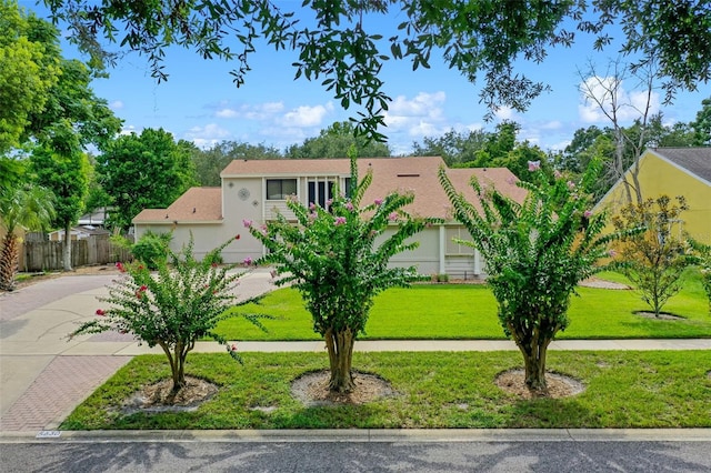 5630 Spring Run Ave, Orlando, FL 32819 - ranch-style house with stucco siding and concrete driveway