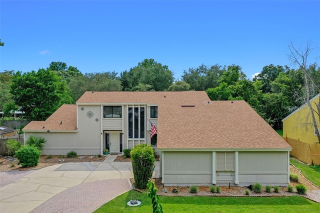 5630 Spring Run Ave, Orlando, FL 32819 - view of front facade with roof with shingles and driveway