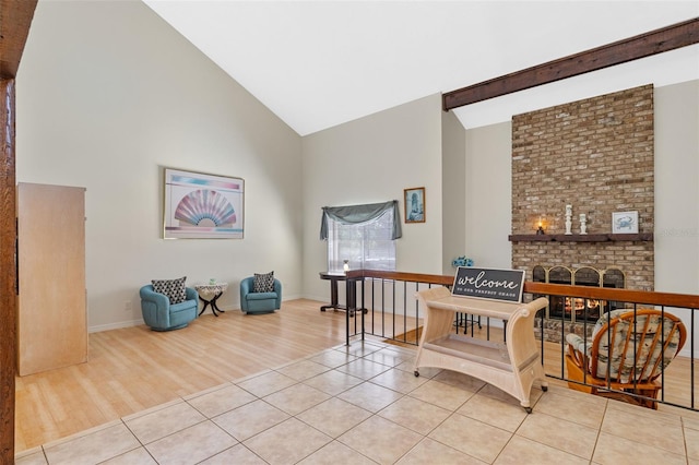 5630 Spring Run Ave, Orlando, FL 32819 - living area with high vaulted ceiling, light wood-type flooring, and a fireplace