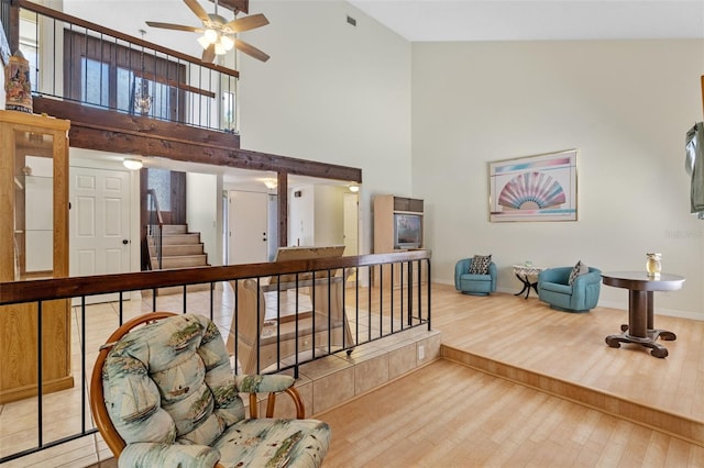 5630 Spring Run Ave, Orlando, FL 32819 - hallway with a high ceiling, wood finished floors, and stairs
