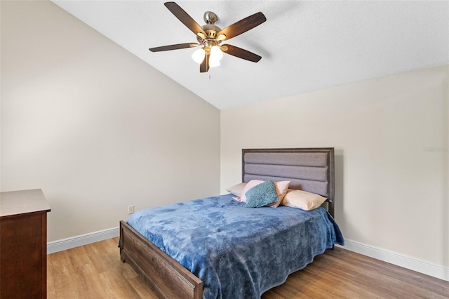 5630 Spring Run Ave, Orlando, FL 32819 - bedroom with wood finished floors, vaulted ceiling, and ceiling fan