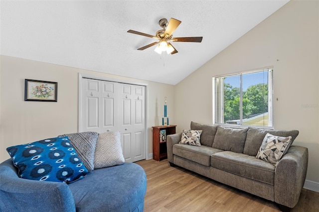 5630 Spring Run Ave, Orlando, FL 32819 - living area featuring vaulted ceiling, ceiling fan, and light wood-type flooring