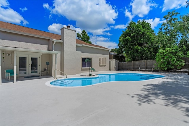 5630 Spring Run Ave, Orlando, FL 32819 - view of pool with french doors, a patio, and a fenced backyard