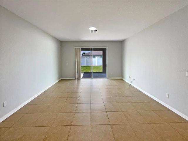 2587 Isabela Ter, Kissimmee, FL 34743 - unfurnished room with light tile patterned flooring and baseboards