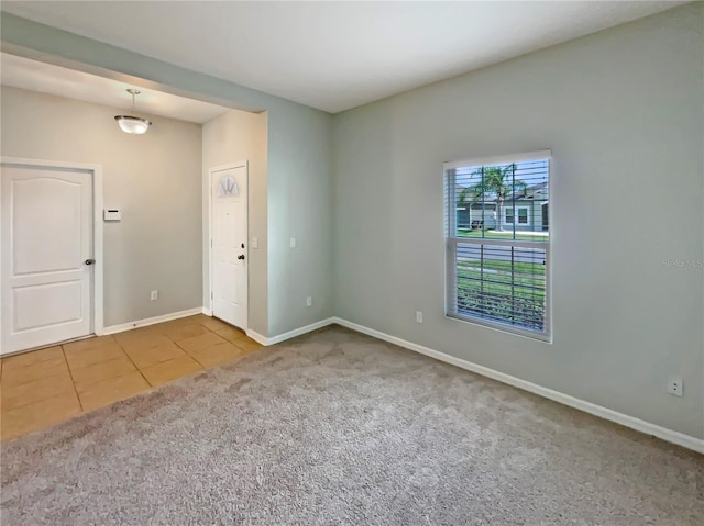 2587 Isabela Ter, Kissimmee, FL 34743 - carpeted empty room with tile patterned flooring and baseboards