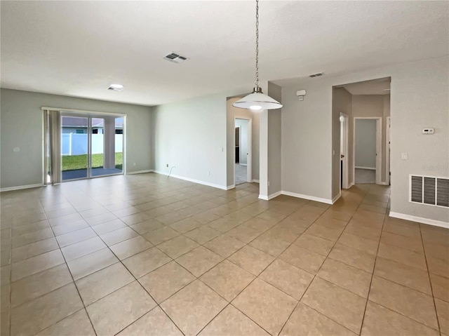 2587 Isabela Ter, Kissimmee, FL 34743 - empty room with light tile patterned floors and baseboards