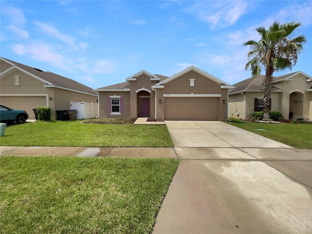 2587 Isabela Ter, Kissimmee, FL 34743 - single story home with stucco siding, a garage, concrete driveway, and a front yard
