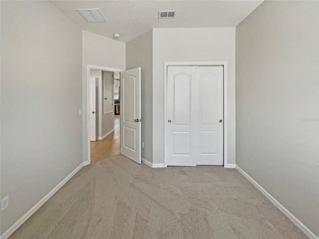 2587 Isabela Ter, Kissimmee, FL 34743 - unfurnished bedroom with carpet floors and a closet