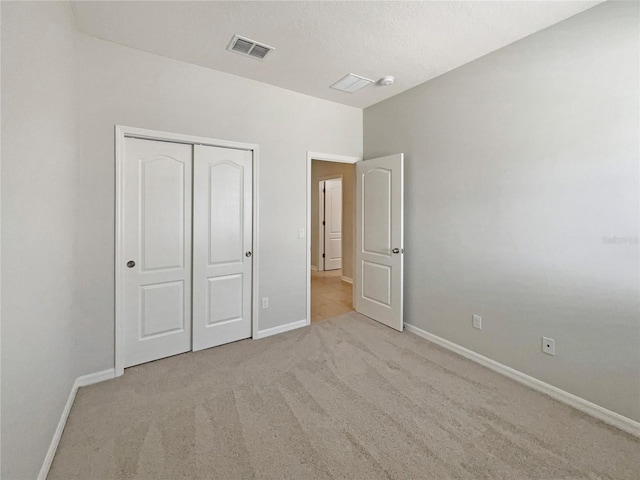 2587 Isabela Ter, Kissimmee, FL 34743 - unfurnished bedroom featuring carpet and a closet