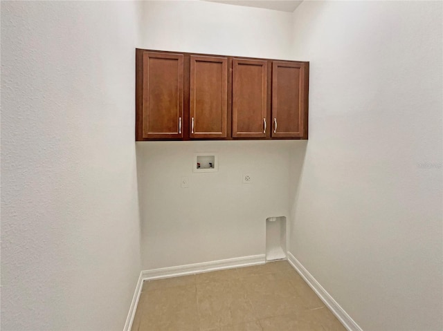 2587 Isabela Ter, Kissimmee, FL 34743 - laundry room with washer hookup, cabinet space, and electric dryer hookup