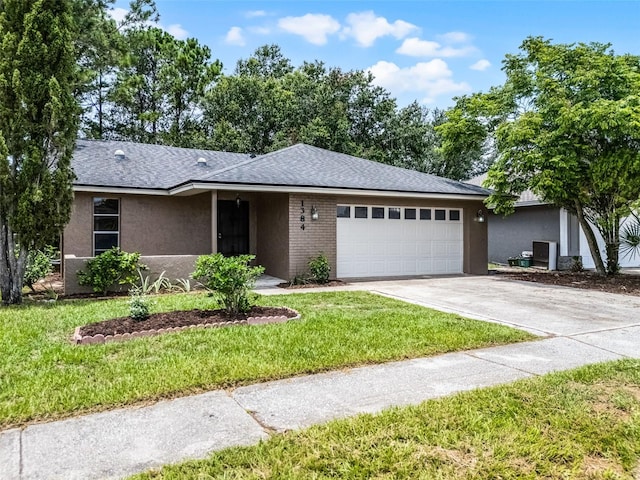 1384 La Paloma Cir, Winter Springs, FL 32708 - single story home with an attached garage, concrete driveway, a front yard, stucco siding, and roof with shingles