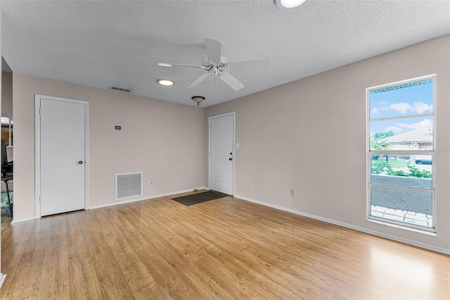 1384 La Paloma Cir, Winter Springs, FL 32708 - spare room featuring light wood-style floors, a textured ceiling, and ceiling fan