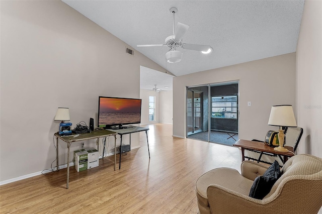 1384 La Paloma Cir, Winter Springs, FL 32708 - living room with a ceiling fan, wood finished floors, a textured ceiling, and high vaulted ceiling
