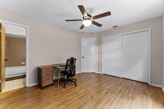 1384 La Paloma Cir, Winter Springs, FL 32708 - office featuring light wood-type flooring, ceiling fan, and a textured ceiling