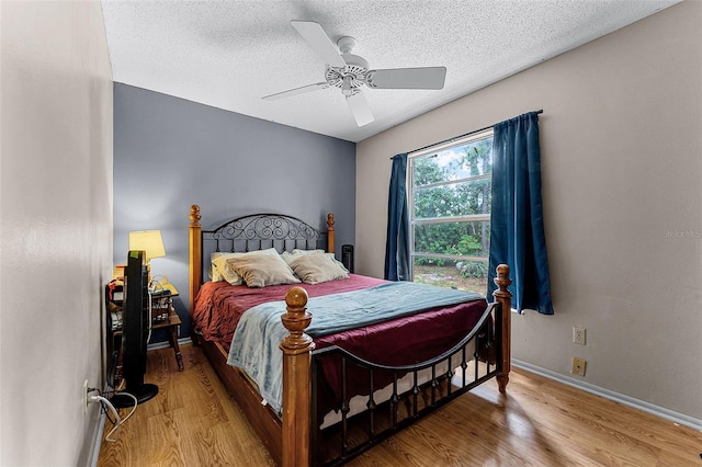 1384 La Paloma Cir, Winter Springs, FL 32708 - bedroom with wood finished floors, a textured ceiling, and a ceiling fan