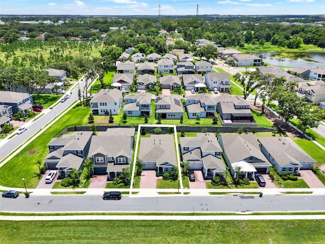 1219 Foltz Loop, Oakland, FL 34787 - aerial view of residential area with a tree filled landscape and a nearby body of water
