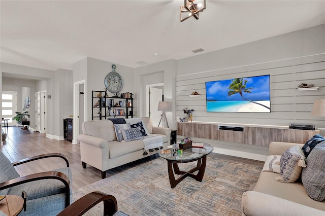 1219 Foltz Loop, Oakland, FL 34787 - living room with wood finished floors and wooden walls