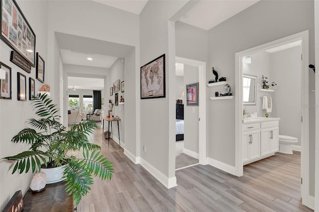 1219 Foltz Loop, Oakland, FL 34787 - corridor featuring light wood-style floors