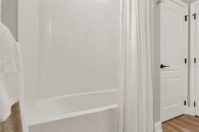 1219 Foltz Loop, Oakland, FL 34787 - bathroom featuring shower / tub combo and wood finished floors