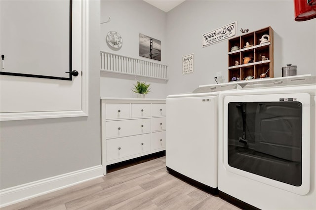 1219 Foltz Loop, Oakland, FL 34787 - laundry room with washing machine and clothes dryer and light wood-style floors